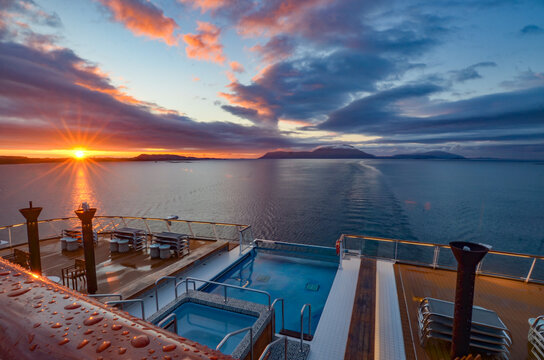 Aft view of cruise ship at sunset near Norway