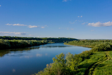 Stunning top view of the sinuous Dniester River. Summer landscape of the Dniester River. Picturesque photo wallpaper. Discover the beauty of earth