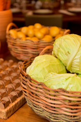 straw basket, basket with green cabbage, basket of cabbages at open market