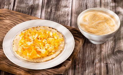 Colombian breakfast with arepa and egg - Traditional food