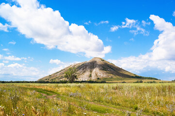 Fototapeta premium The view from the field on a single mountain Yuraktau. Bashkiriya, landscape