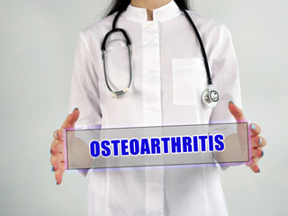 Healthcare concept about OSTEOARTHRITIS OA with phrase on the piece of paper.