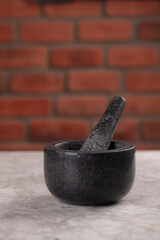 granite pestle on marble floor