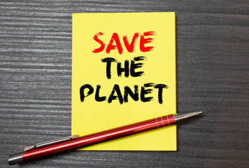 Save the Planet - concept of text on sticky note. Closeup of a personal agenda