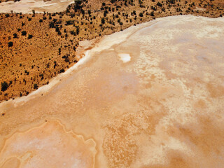 Amazing Rainbow Valley in Northern Territory, Australia, just outisde Alice Springs.  Beautiful red and orange rock formation with blue sky and orange sands