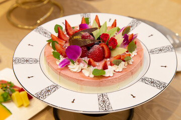 Two layers of pudding with melon and strawberries