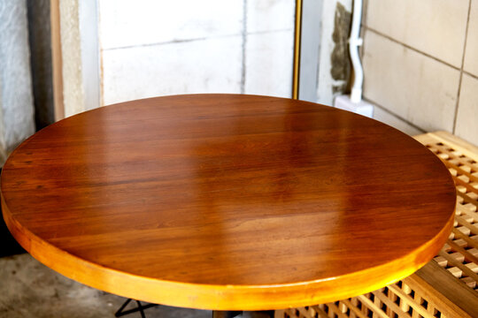 Blank top view of wooden cafe and shop round table for product display, montage and graphical element.