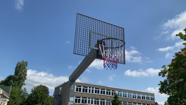 Basketball hoop with the metal board on a school site