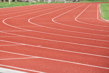 Selective blur on the curve on a running track, an athletics field used for athletism competition, like sprint, or running race, and for olympic competitive events. ..