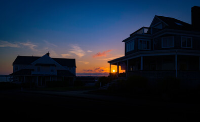 Sunrise over the hilltop of a coastal village on Cape Cod