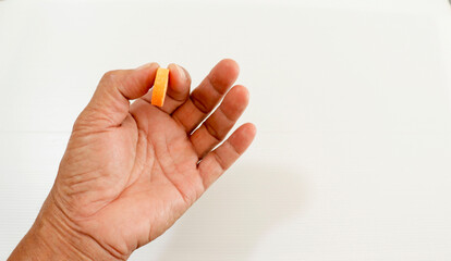 Pills in hand of man, isolated, white background
