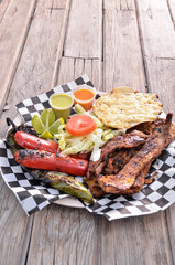 Costillita mexican food wooden background