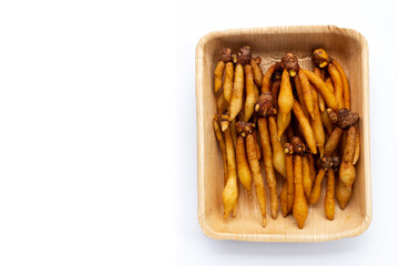 Finger root in plate on white background.