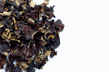 Dried black fungus on white background.