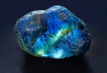 rough blue sapphire gemstone with yellow cross-section from Australia