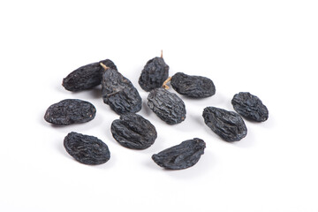 Dried black raisins isolated on white background