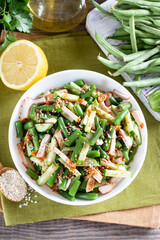Green beans salad with chicken and cucumber. Hearty lunch. Top view