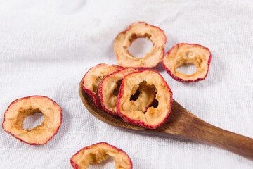 Dried hawthorn slices on wooden  background