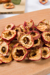 Dried hawthorn slices on wooden  background