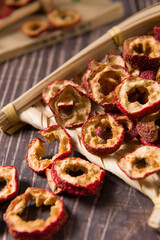 Dried hawthorn slices on wooden  background