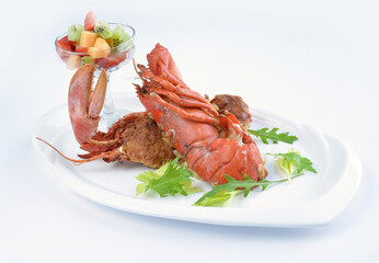 western baked whole cheese fresh lobster seafood with fruit cocktail salad in white background asian halal seafood menu