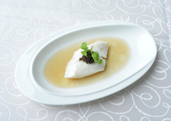 steamed slices grouper fish fillet with Chinese herbal fungus miso sauce seafood in white background asian halal seafood menu