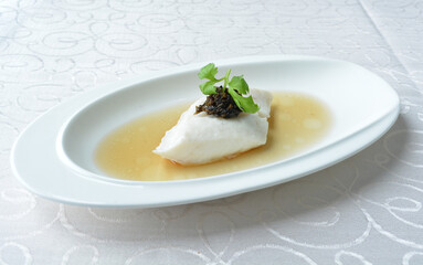 steamed slices grouper fish fillet with Chinese herbal fungus miso sauce seafood in white background asian halal seafood menu