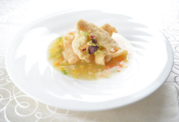 deep fried slices grouper fish fillet in golden corn yellow creamy sauce in white background asian halal seafood menu