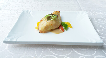 grilled bbq cod fish fillet with sweet honey mango mayonnaise sauce with mixed fruits in white...