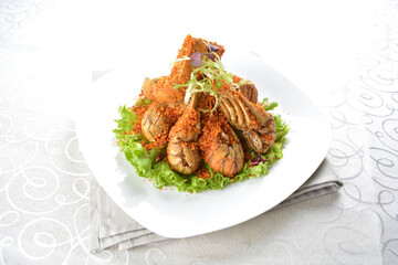 stir fried crayfish prawn seafood with butter spicy cereal milk sauce taste in white background asian halal seafood menu