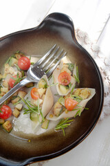Vegan pasta shell iced with tofu and courgette sauce and olive oil