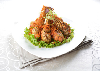 stir fried crayfish prawn seafood with butter spicy cereal milk sauce taste in white background asian halal seafood menu