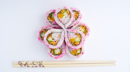 Top view of a beautiful pattern arranged with two layers of sushi, copy space