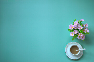 Obraz na płótnie Canvas Top view of coffee on a blue desk, a small potted plant, Copy space