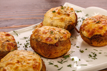 Baked champignon with cheese and herbs