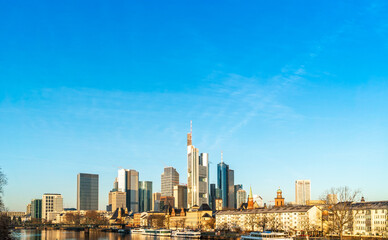 Fototapeta na wymiar Skyline of Frankfurt, Germany and surrounding skyscrapers in sunny weather under blue sky