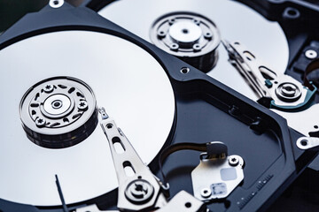 two open computer hard drives for repair. Data safety concept.