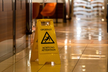 slippery floor warning sign and symbol on the passenger ferry restaurant floor