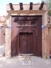 Fototapeta na wymiar old wooden door in ancient Fortress