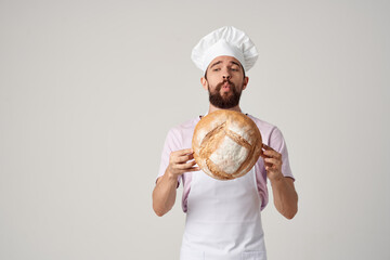 male chef holding bread in his hands cooking baker professional