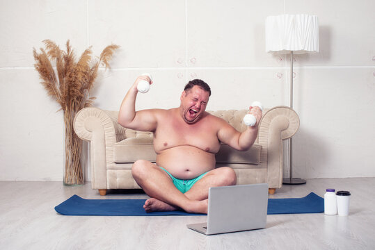 Sports and healthy lifestyle. Funny fat man goes in for sports.