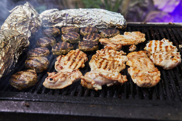 BBQ burgers, grilled chicken legs BBQ smoke party. Close-up