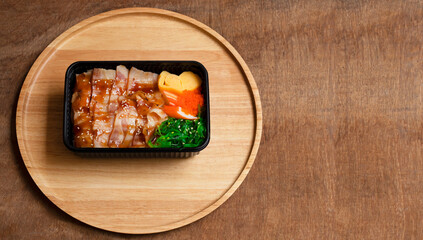 Topview Rice and bacon with teriyaki sauce on wooden floor