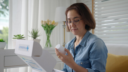 Asia people or latin lady sit at home sofa couch buy herbal self cure Rx pill or covid free first aid kit postal box hospital clinic post mail in health care help service in telehealth telemedicine.