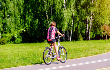 Cyclist ride on the bike path in the city Park
