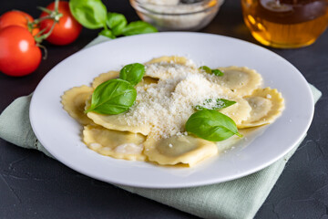 Ravioli with ricotta, spinach and basil in a white plate