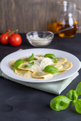 Ravioli with ricotta, spinach and basil in a white plate