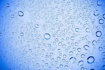 Water bubble on Blue glass.