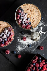 Ryazhenka mousse in glass bowls decorated with fresh berries