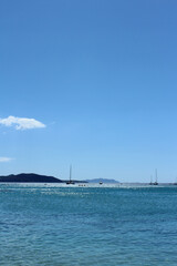 Obraz premium Beautiful blue sea coast with yachts, boats and the background of clear sky in June in La Ciotat in Provence-Cote-d'Azur, a popular holiday destination for vacation travellers in France.